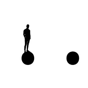 A a small figure of a man standing on a dot.