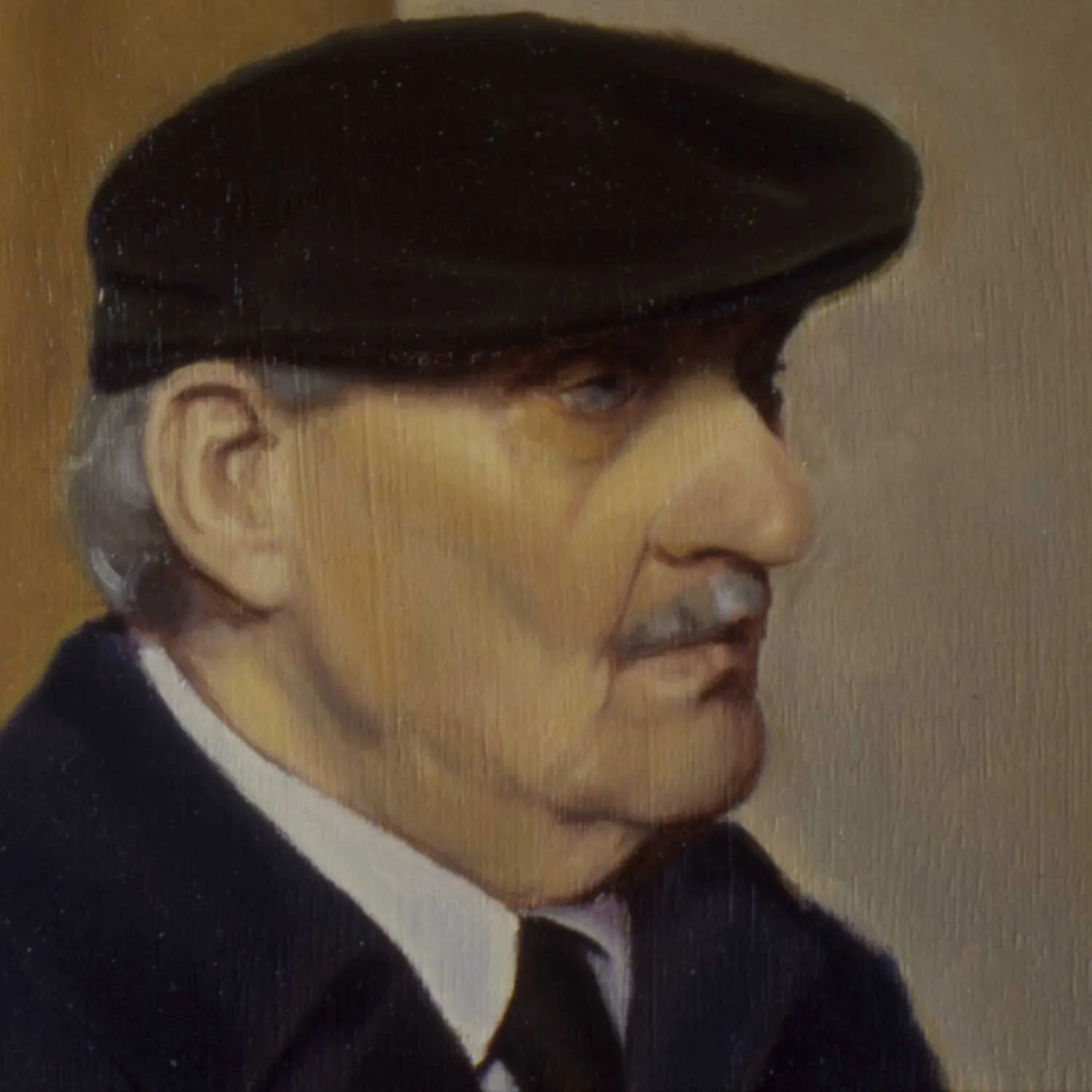 A portrait of an older gentleman wearing a cap.