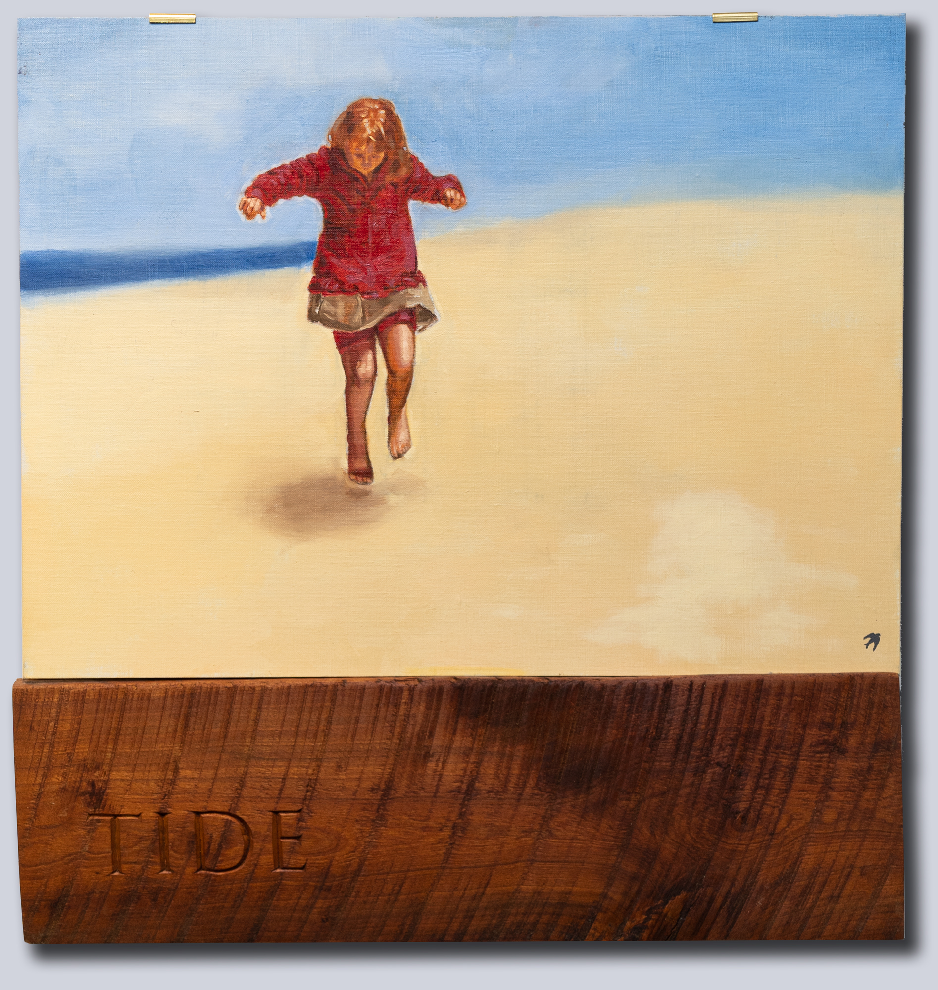 A painting of a young child dances on a beach with blue sky behind. Below is a length of wood with Tide carved into it.