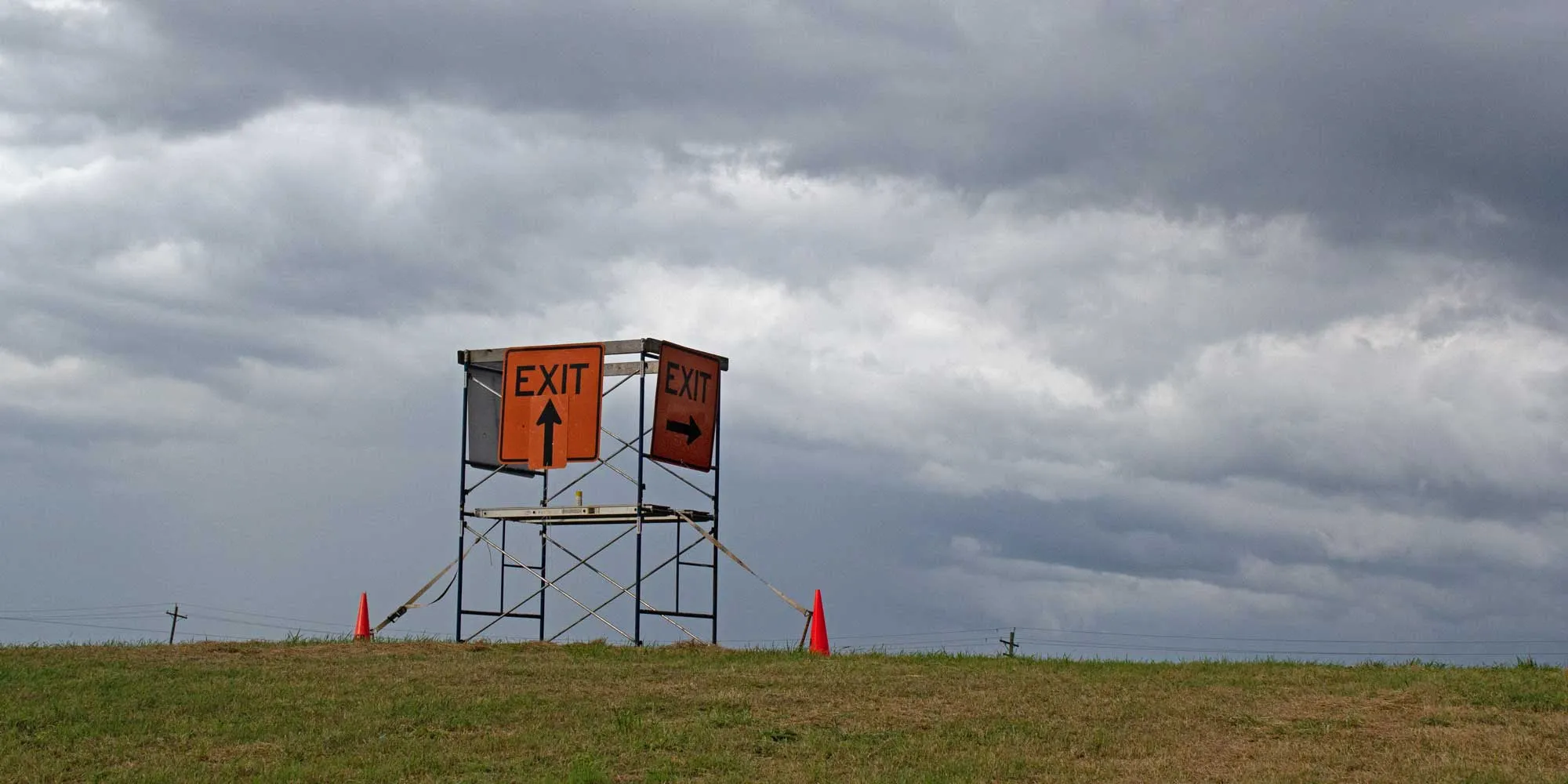 Scaffold in landscape with no exit sign.