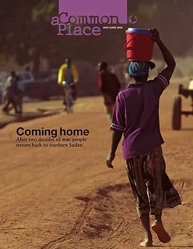 A figure walks away from us on a dusty road